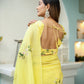 Elegant yellow floral organza saree with a stylish back design and intricate embroidery details