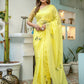 Stylera yellow floral organza saree with delicate embroidery in a bright setting