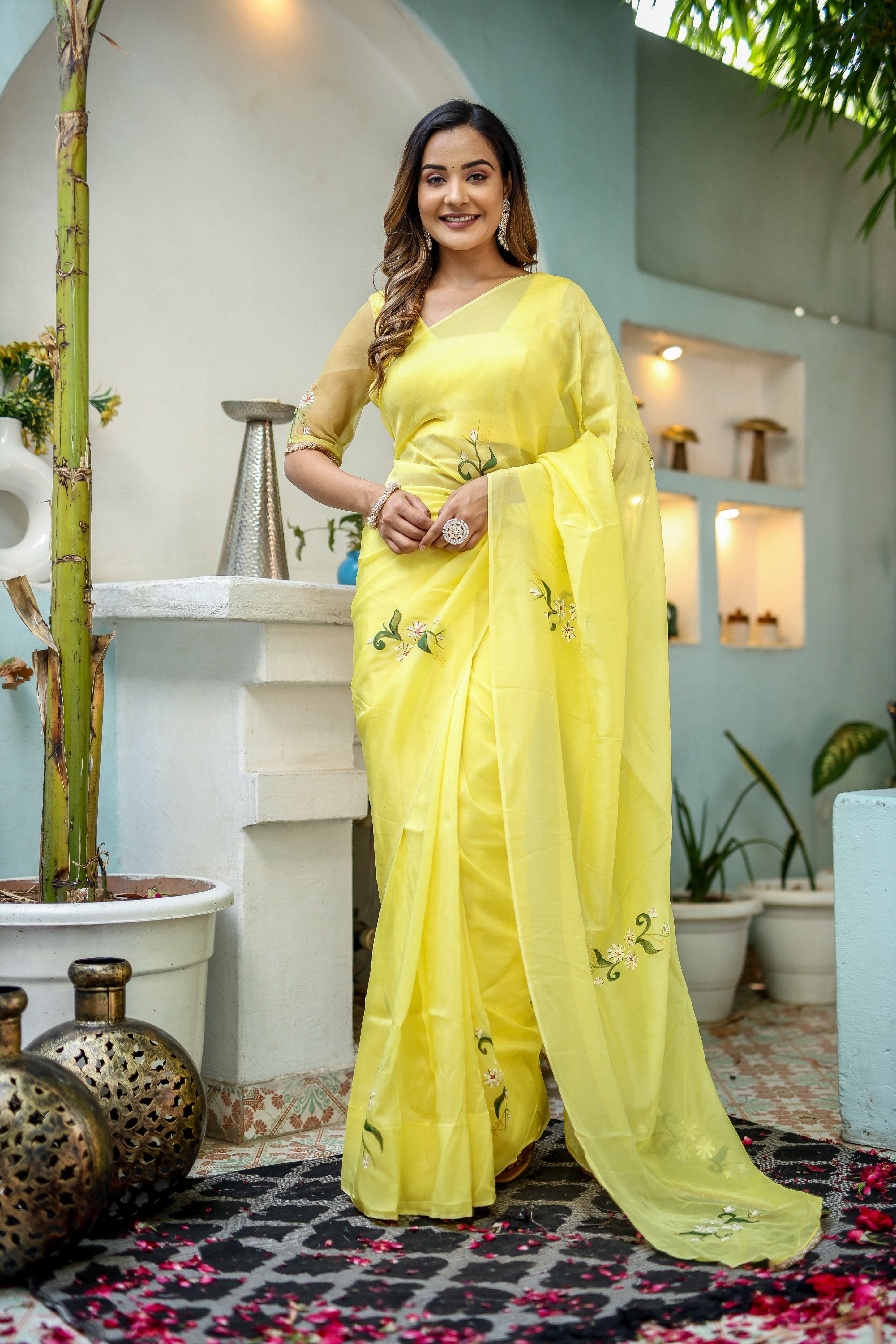 Stylera yellow floral organza saree with delicate embroidery in a bright setting