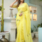Elegant yellow floral organza saree from Stylera with delicate embroidery for festive occasions.