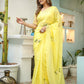 Elegant yellow floral organza saree from Stylera, perfect for festive occasions