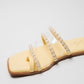 Yellow pearl sandals for women by Stylera with clear straps and pearl embellishments