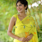 Elegant yellow saree with floral print draped gracefully, perfect for festive occasions