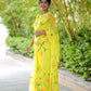 Stylera yellow saree with floral print, featuring vibrant flowers and elegant draping for festive occasions