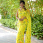 Elegant yellow saree with floral print, perfect for festive occasions and summer events