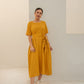 Yellow summer midi dress with short sleeves and a tied waist for a stylish look