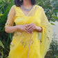 Model wearing a beautiful yellow sunflower saree with floral embroidery and elegant styling