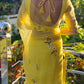 Elegant yellow sunflower saree with floral embroidery, perfect for festive occasions and celebrations