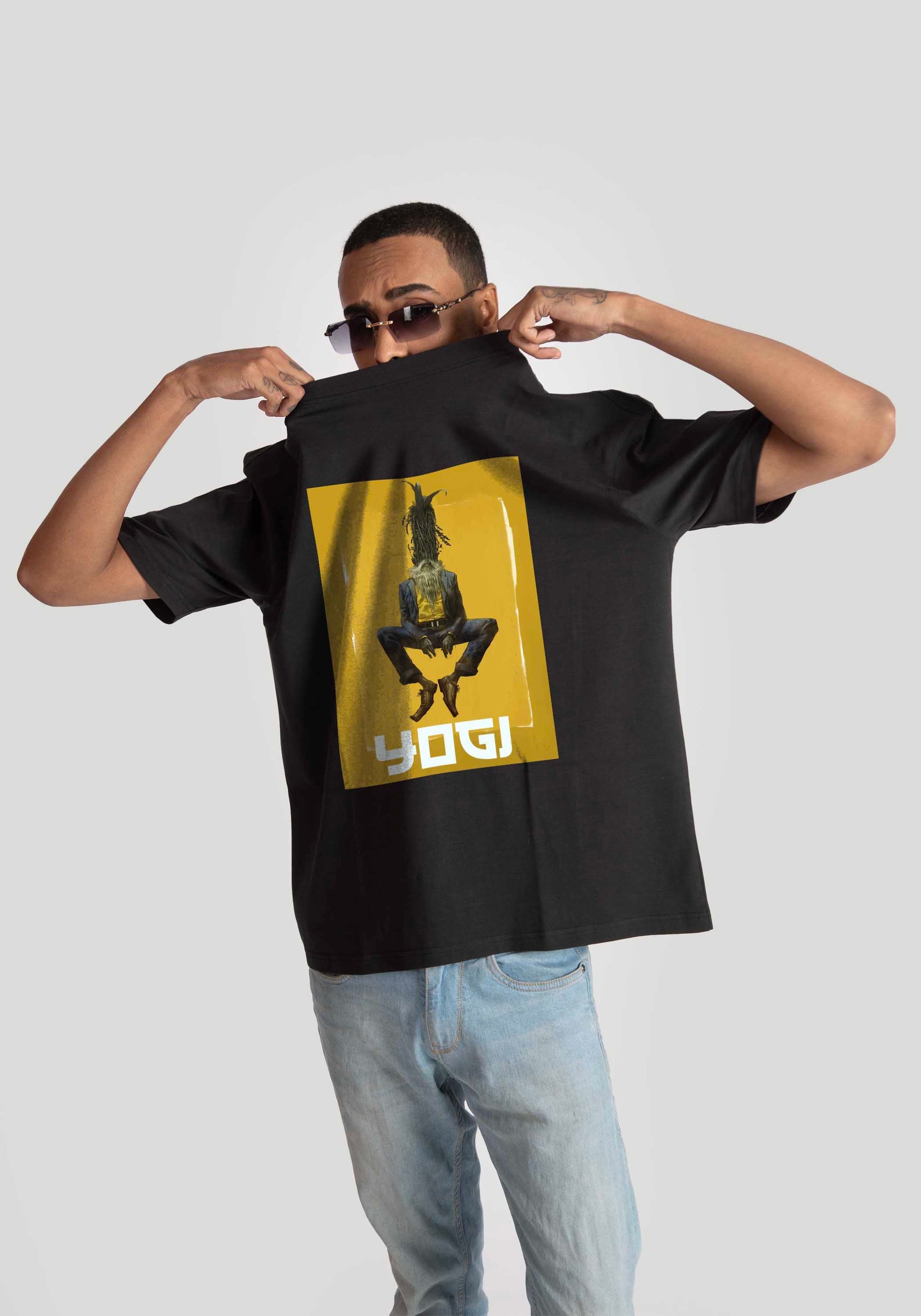 Stylera Lifestyle black oversized graphic t-shirt with yellow yoga print worn by male model