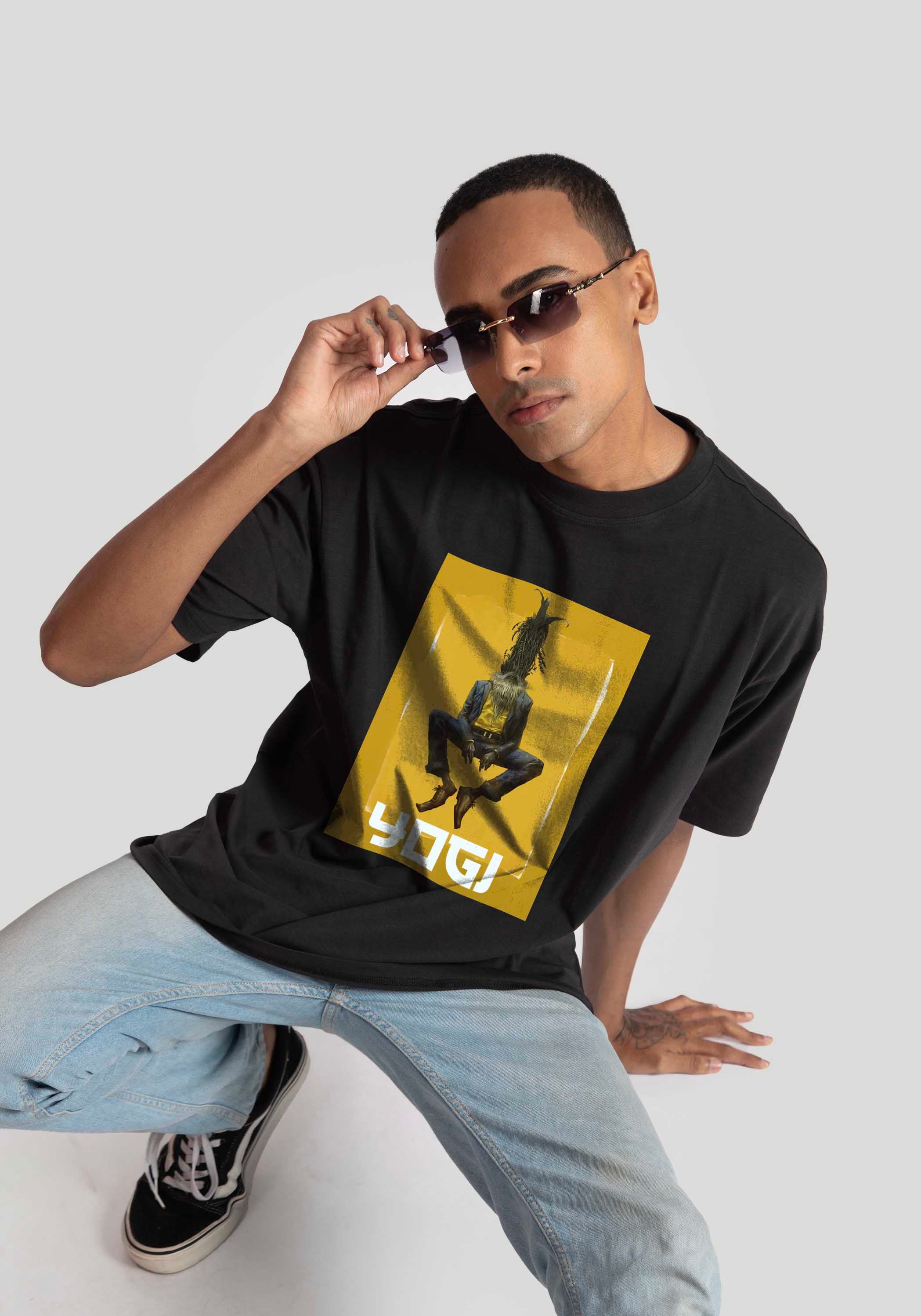 Stylera Lifestyle black oversized graphic t-shirt with yellow rectangular print worn by male model with sunglasses