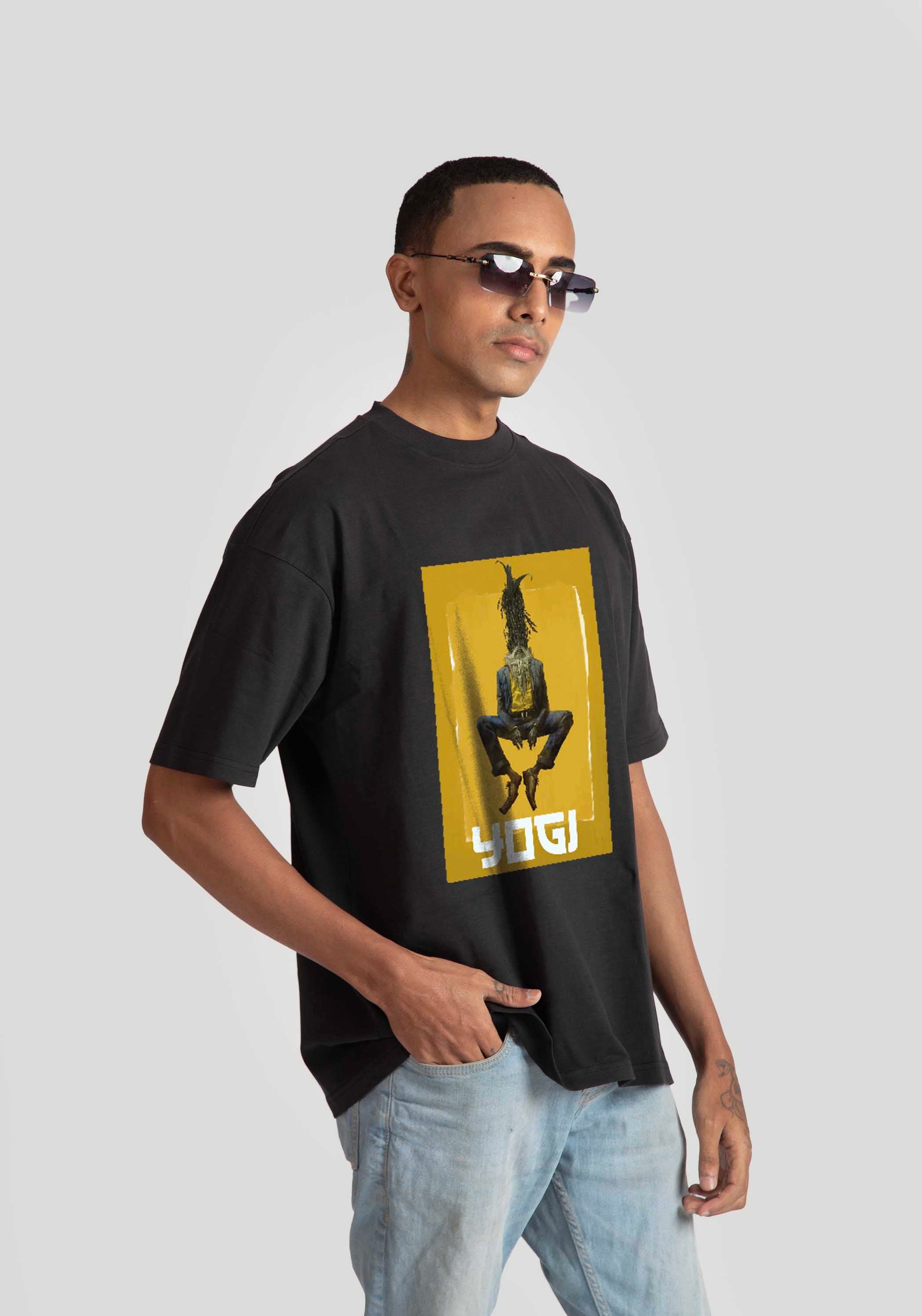Stylera Lifestyle black oversized graphic t-shirt with yellow and black design worn with light jeans